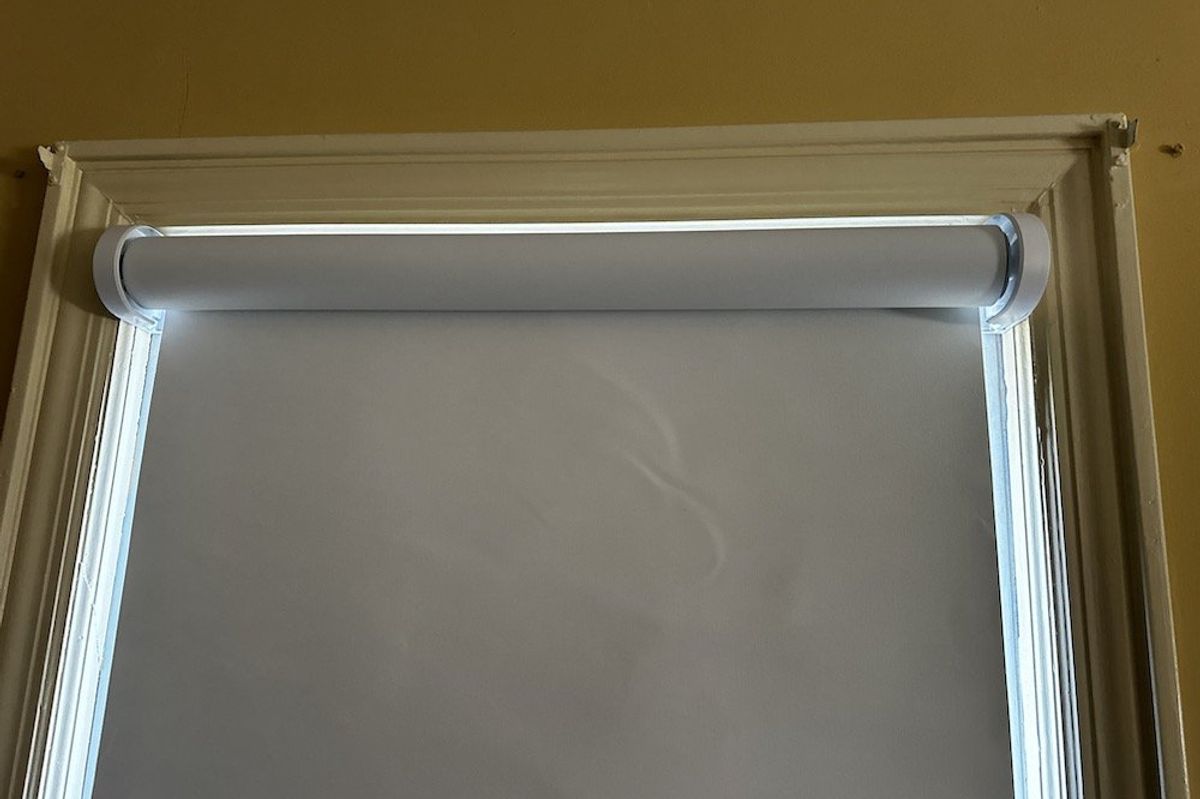 a photo of Lutron Caseta Smart Shades installed on a window
